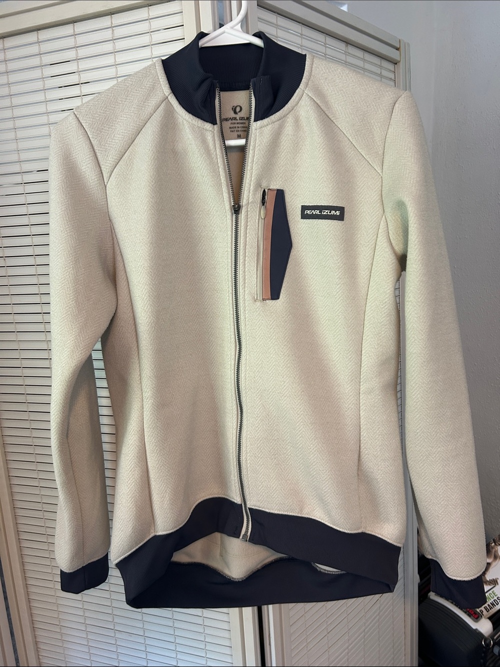 Pearl Izumi Cream Jacket with Black Trim and Chest Zip